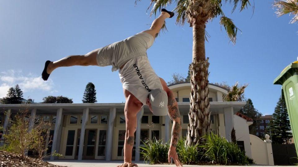 Josh from Moves Method mid cartwheel.