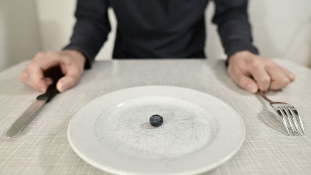 Weight loss plans that involve extreme calorie restriction can make it harder to lose weight, due to a phenomenon called metabolic adaptation.